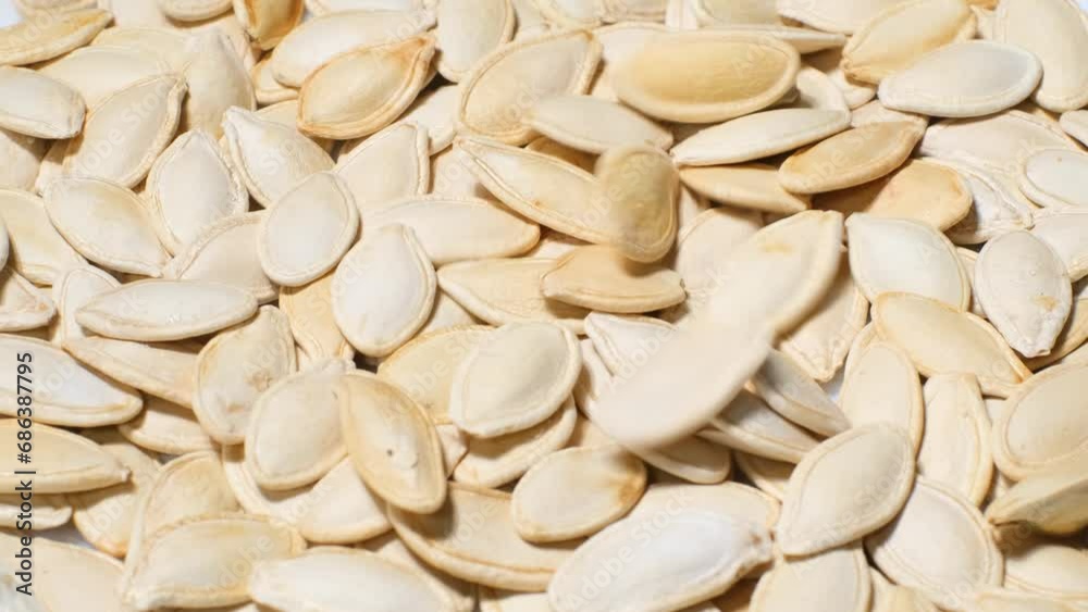 Close up of pumpkin seeds. Collecting seeds. Healthy food
