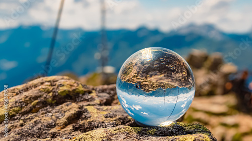 Crystal ball alpine summer landscape shot at Mount Kreuzjoch, Schruns, Bludenz, Montafon, Vorarlberg, Austria