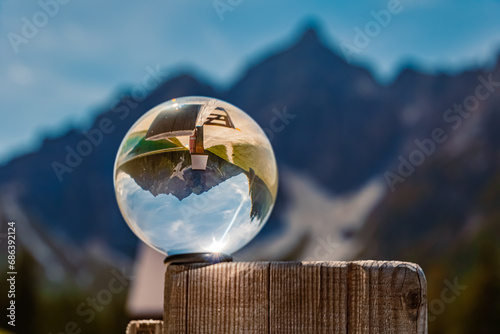 Crystal ball alpine summer landscape shot at Serles cable car station, Mieders, Stubaital valley, Innsbruck, Austria photo