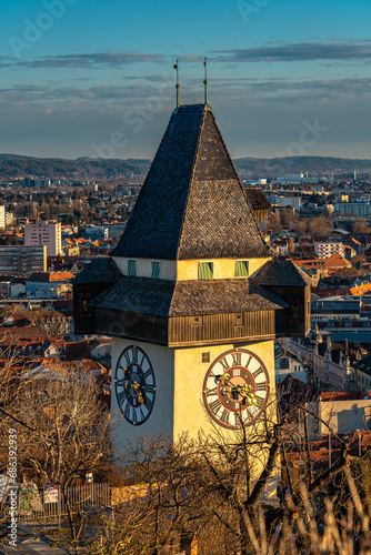 Aerial view of clock tower on Schlossberg and Graz city old town