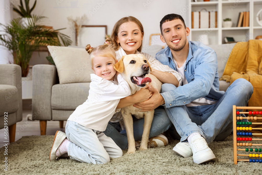 Happy family with Labrador dog at home Happy family with Labrador dog at home