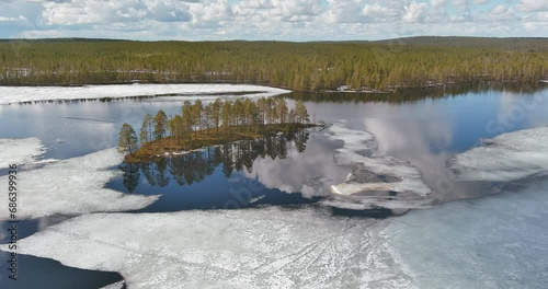 Aerial landscape view at Hossa National Park with lake and forest in cloudy spring weather, Suomussalmi, Finland.