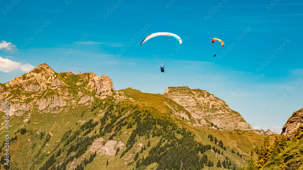 Alpine summer view with paragliders at Mount Fulseck, Dorfgastein, St. Johann im Pongau, Salzburg, Austria Alpine summer view with paragliders at Mount Fulseck, Dorfgastein, St. Johann im Pongau, Salzburg, Austria