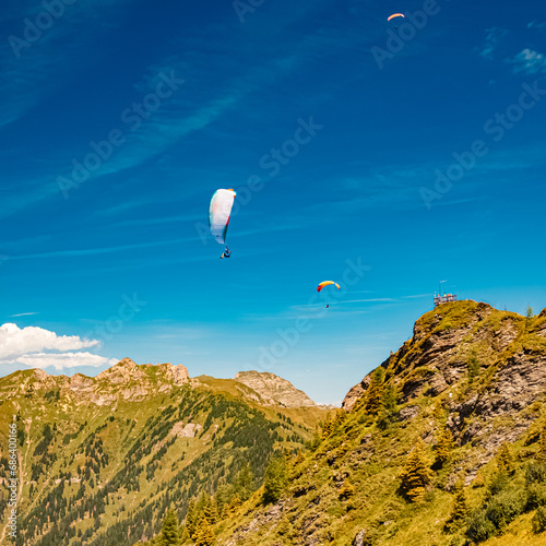 Alpine summer view with paragliders at Mount Fulseck, Dorfgastein, St. Johann im Pongau, Salzburg, Austria photo