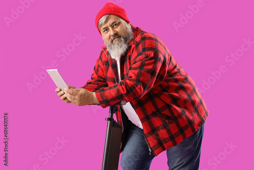 Mature man with tablet comp...