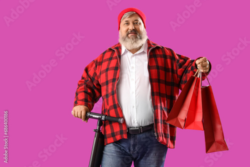 Mature man with shopping ba...