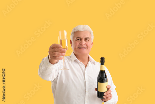 Smiling senior man holding ...