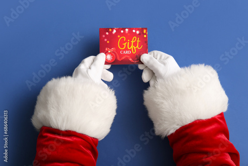 Santa hands with gift card ...