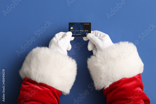 Santa hands with credit car...