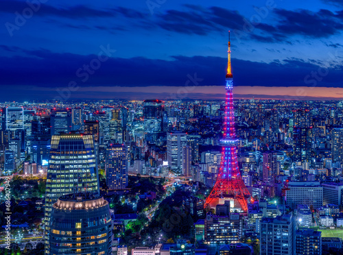 HDR image of Tokyo tower with Diamond Veil light up and Tokyo cityscape at magic hour.