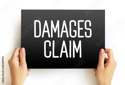 Damages Claim - money to be paid to them by a person who has damaged their reputation or property, or who has injured them, text concept on card photo