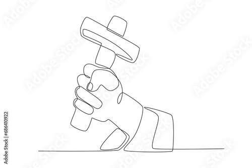 A hand holds a hammer. Reforma protestante one-line drawing