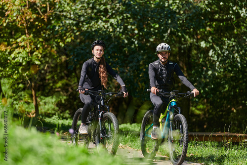 A blissful couple, adorned in professional cycling gear, enjoys a romantic bicycle ride through a park, surrounded by modern natural attractions, radiating love and happiness