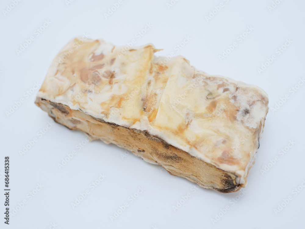 rotten and moldy tempeh, expired tempeh isolated on white background rotten and moldy tempeh, expired tempeh isolated on white background