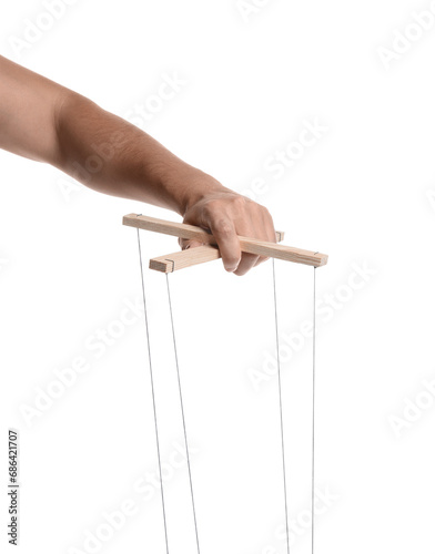 Man holding puppet control bar with strings on white background  closeup