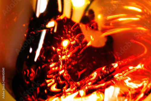 Fotografie A close-up, abstract shot capturing the swirling red and orange patterns of ligh