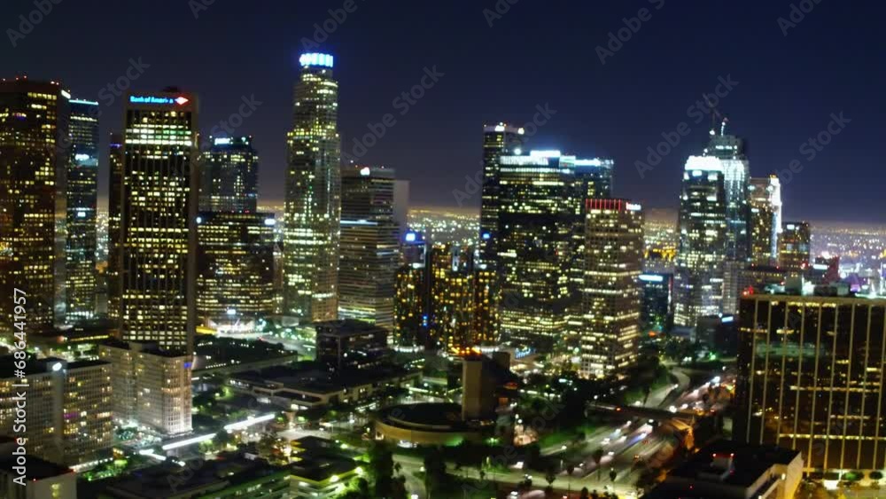 Aerial Panning Shot Of Sparkling Modern Buildings In Financial District, Drone Flying Backwards At Night - Los Angeles, California Aerial Panning Shot Of Sparkling Modern Buildings In Financial District, Drone Flying Backwards At Night - Los Angeles, California
