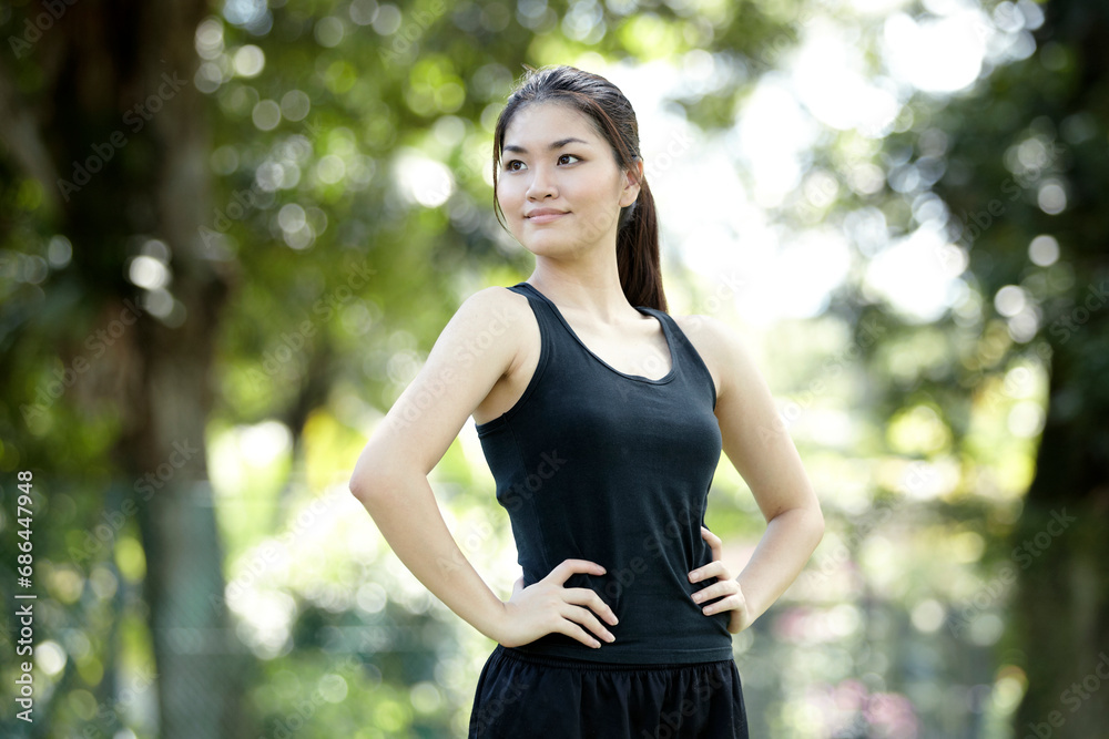 Asian woman ready to go cross country running. Asian woman ready to go cross country running.
