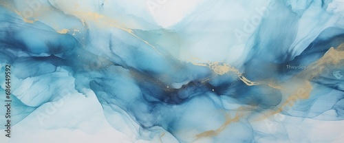 Abstract blue art with gray and gold a?" light blue background with beautiful smudges and stains made with alcohol ink and golden paint. Blue fluid texture poster resembles watercolor or aquarelle