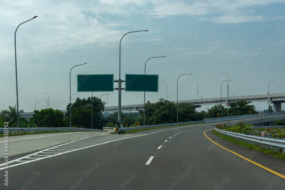Blank overhead freeway directional sign. copy space. Blank road sign at the highway