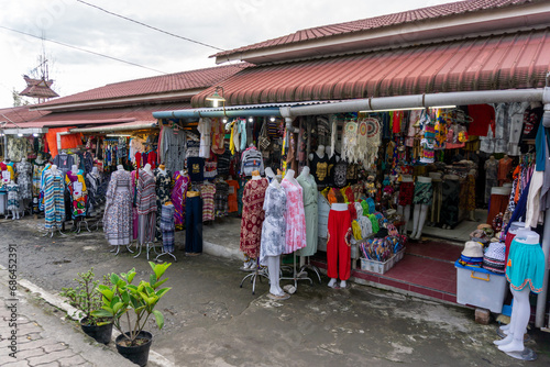 Berastagi souvenir shop for traveller. Local tourist gift shop sells handicraft, clothing and souvenir in berastagi Indonesia © fery