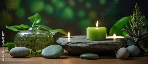 Environmentally friendly design elements in house interiors organic materials wooden table with a wooden cup holding stones and a green candle