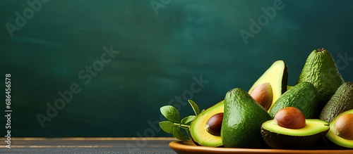 Avocado halves on dinner table photo