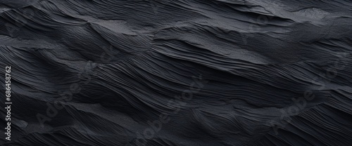 Black Sand dune. Black Sand beach macro photography. Background, texture, wave pattern of oceanic sand on the beach, black. Texture of beach sand. Black beach