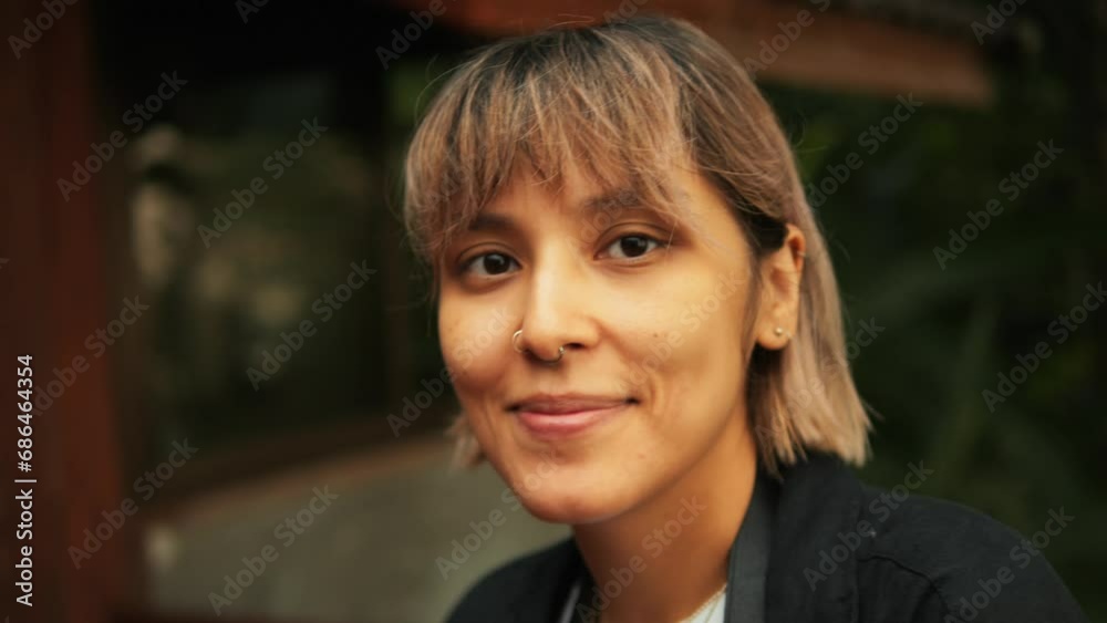 Portrait of a Young Woman Smiling at the Camera While Playfully Interacting with a Large Yellow Tropical Leaf in Front of Her Face, 4K Autumn Forest Lifestyle Video. Portrait of a Young Woman Smiling at the Camera While Playfully Interacting with a Large Yellow Tropical Leaf in Front of Her Face, 4K Autumn Forest Lifestyle Video.