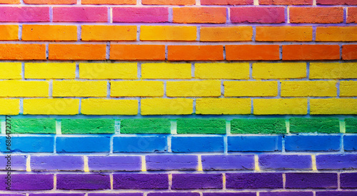 LGBTQ pride flag on brick wall