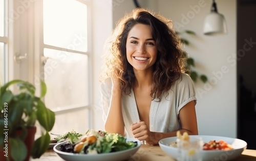 A young woman eating behind kitchen table