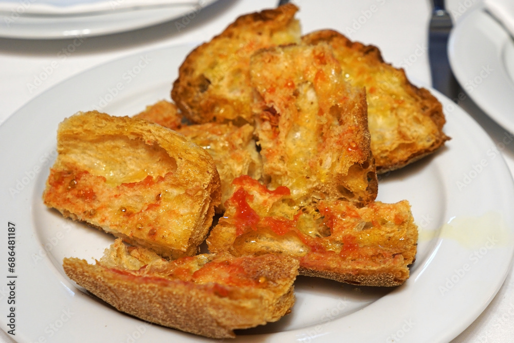 Close up Pan con Tomate (Pa amb tomàquet), bread toast with tomato- Classic traditional Spanish tapas Close up Pan con Tomate (Pa amb tomàquet), bread toast with tomato- Classic traditional Spanish tapas