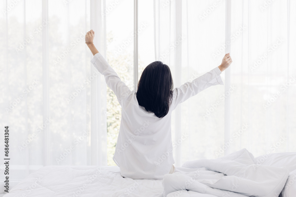 custom made wallpaper toronto digitalWoman stretching in bed after wake up. stretching and happy woman waking up in the morning after sleep, rest and relax at home.