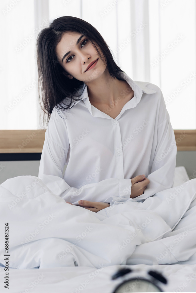 Woman stretching in bed after wake up. stretching and happy woman waking up in the morning after sleep, rest and relax at home. Woman stretching in bed after wake up. stretching and happy woman waking up in the morning after sleep, rest and relax at home.