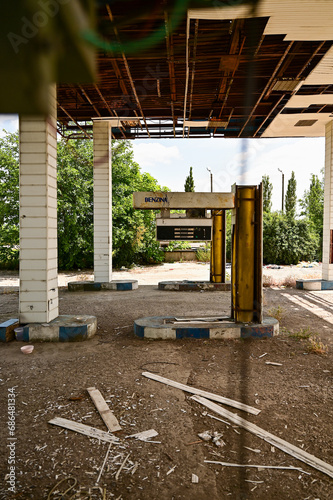 Old run-down gas station with gas pumps as a lost place in Wallachia in Romania photo