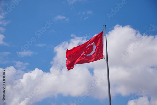 Low Angle View Of Turkish Flag Against Sky.