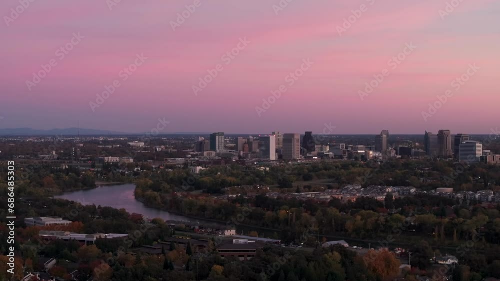 Panning to the right drone shot of sunset in Sacramento, CA with a colorful sky Panning to the right drone shot of sunset in Sacramento, CA with a colorful sky