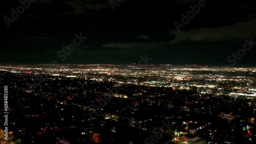 High elevation drone shot of Salt Lake City, Utah suburbs at night photo