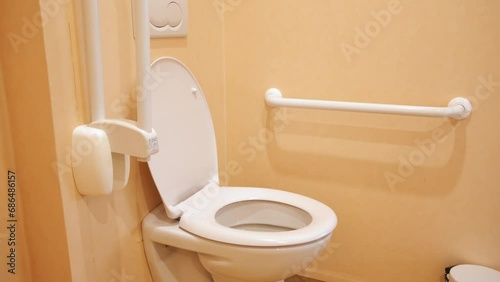 Accessible Toilet With Grab Rails. - close up shot photo