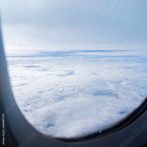 Clouds background scenic sky nature view from an airplane window during flight. Travel concept, Flight, Journey, Adventure, Explore, Destination,Tourism, Vacation, Trip, Wanderlust, Aerial View