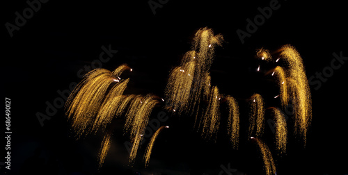 Fireworks show under defocus or blur concepts with isolated black background at night, this celebration is for the International Fireworks Festival in Pattaya on Nov 24-25 in Thailand