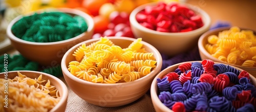 Children using colored pasta for sensory play, crafts, and learning colors; promoting Montessori activities, fine motor skill games, and toddler play.
