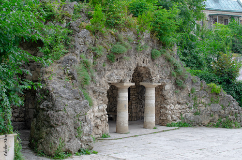 Fototapeta Naklejka Na Ścianę i Meble -  antique columns.a stone cave.a stone grotto.a grotto with benches.