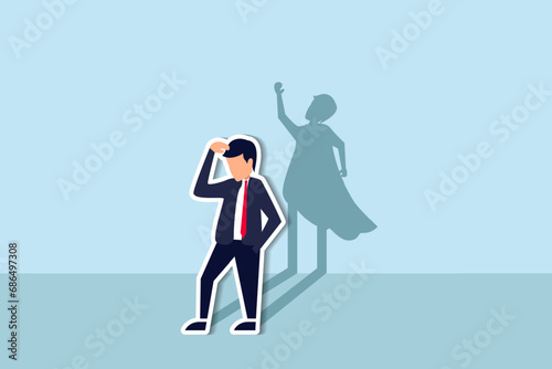 Self confidence or leadership to bring full potential and strength, motivation to achieve business success concept, self doubt businessman standing with his skillful power superhero shadow on the wall