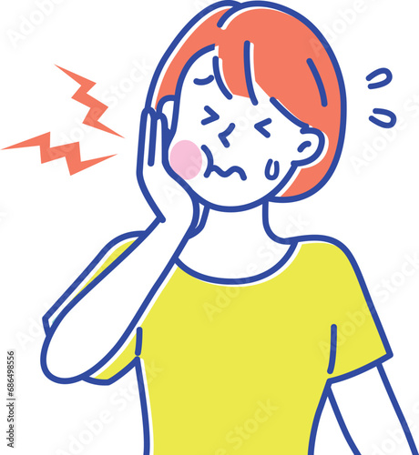 歯が痛くなって手でほっぺたを抑えている若い女性