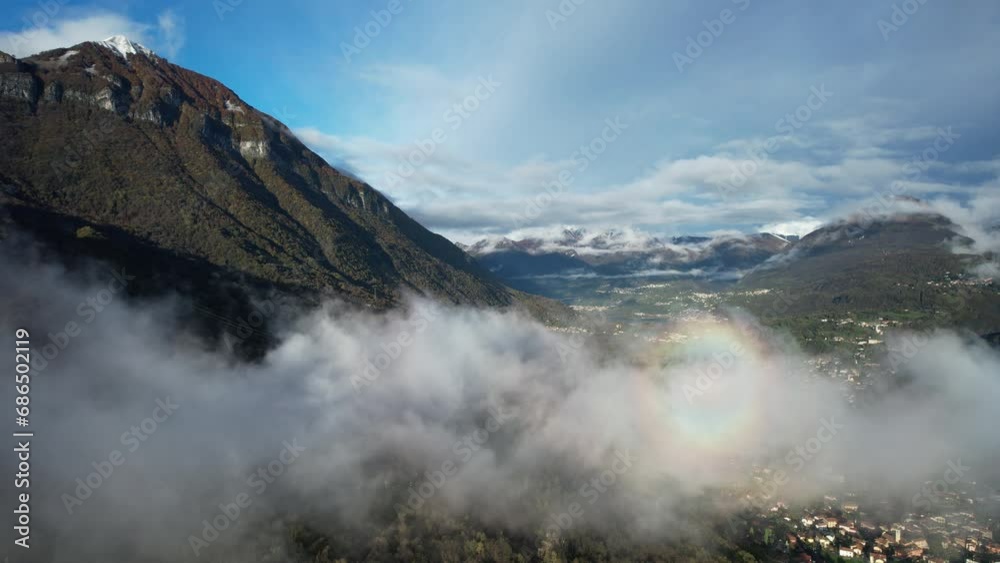 A Majestic Mountain with a Vibrant Rainbow Over Como Lake, Italy A Majestic Mountain with a Vibrant Rainbow Over Como Lake, Italy