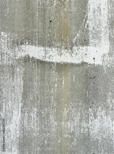 An old wall is painted with white paint as an abstract background. Texture