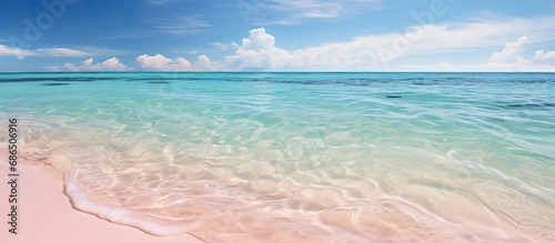 Clear waters and pink sand on secluded seven-mile beach in the tropical Caribbean of Grand Cayman.