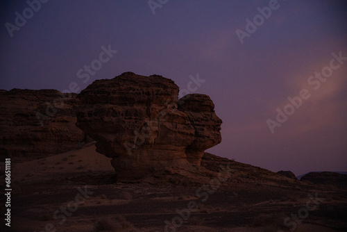 Saudi girl exploring Hegra in Medina Region on sunset time.