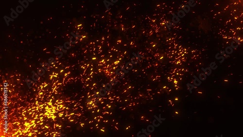 Flying sparks and coals from a fire. abstract glowing particles of burning fire and smoke on a black background, bonfire flares.. photo